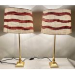 TABLE LAMPS, a pair 70cm x 35cm gilt frames with striped shades. (2)