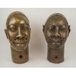 BRONZE BENIN KING OBA HEADS, a pair, of the Yoruba people of Nigeria, 34cm x 18cm. (2)