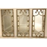 ARCHITECTURAL WALL MIRRORS, a set of three, 111cm x 48cm, aged metal frames. (3)