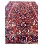 ANTIQUE PERSIAN HERIZ CARPET, 350cm x 230cm.