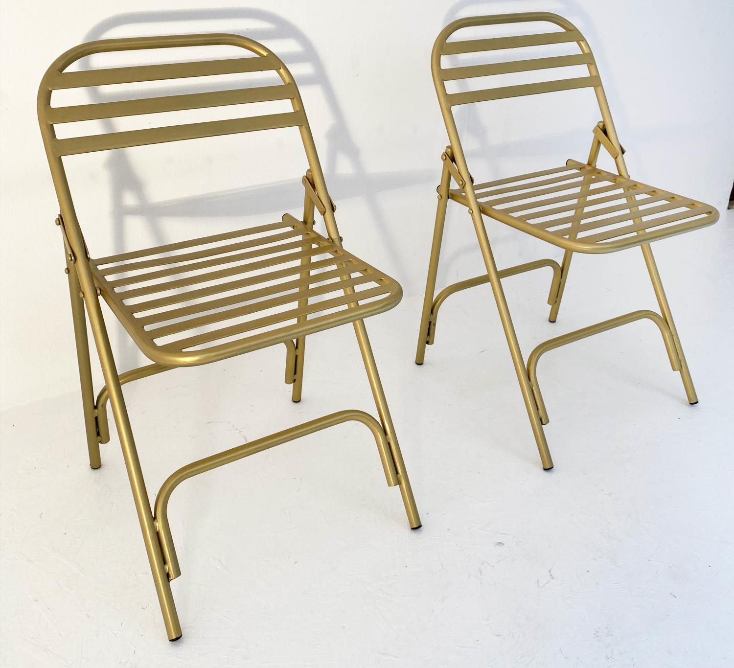 TERRACE CHAIRS, a pair, 76cm x 44cm x 45cm, 1950's French style, gilt metal. (2)