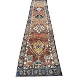 ANTIQUE PERSIAN BAKSHAISH DESIGN RUNNER, 390cm x 80cm.