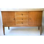 GORDON RUSSELL SIDEBOARD, 1960's walnut with three drawers flanked by cupboards, stamped 'Gordon