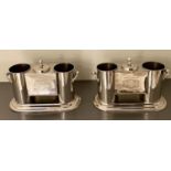 WINE COOLERS, a pair, stamped with wine houses, polished metal, 35cm x 15cm x 25cm. (2)