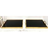 DRINKS TRAYS, a pair, 8cm x 50cm x 30cm, smoked glass and gilt metal. (2)