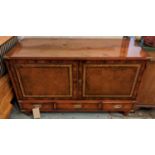 CAMPAIGN STYLE DRINKS BAR, leather panelled doors enclosing glass shelves above three drawers,