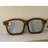 OPTICIANS WALL MIRROR, walnut frame, 140cm x 57cm.