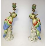 PARROT CANDLESTICKS, a pair, Continental style porcelain in the form of perched parrot with entwined