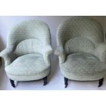 ARMCHAIRS, a pair Edwardian green weave fabric upholstered with rounded arched backs and turned