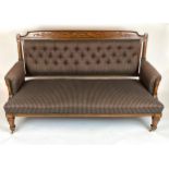 SOFA, late 19th century American, carved walnut showframe with buttoned plaid upholstery, 103cm H
