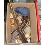 BOX CONTAINING NOVELTY REPLICA GUNS, EASTERN STYLE PUPPETS, GLASS PAPER WEIGHT ETC