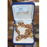 9 CARAT GOLD CHARM BRACELET - APPROXIMATE WEIGHT = 30.7 GRAMS