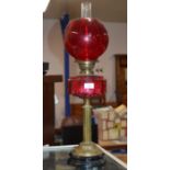 COLUMNED DOUBLE BURNER PARAFFIN LAMP WITH CRANBERRY GLASS RESERVOIR, COLOURED GLASS SHADE & GLASS