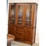 MODERN MAHOGANY STAINED TRIPLE DOOR DISPLAY CABINET WITH PRESS BENEATH