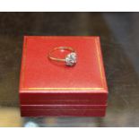 8 STONE DIAMOND CLUSTER RING ON 18 CARAT GOLD BAND - APPROXIMATE WEIGHT = 3.6 GRAMS