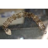 9 CARAT GOLD GATE BRACELET WITH HEART PADLOCK - APPROXIMATE WEIGHT = 10.4 GRAMS