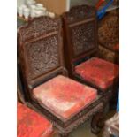 PAIR OF INDIAN STYLE HEAVY CARVED WOODEN PADDED CHAIRS
