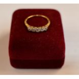 5 STONE DIAMOND RING ON GOLD BAND - APPROXIMATE WEIGHT = 2.7 GRAMS