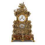 Orologio da appoggio in metallo dorato con placchette in porcellana policroma