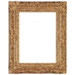 AN ELABORATE GILT FRAME