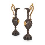 PAIR OF RENAISSANCE STYLE PATINATED AND GILT BRONZE EWERS 20TH CENTURY