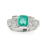 A Colombian emerald and diamond set ring