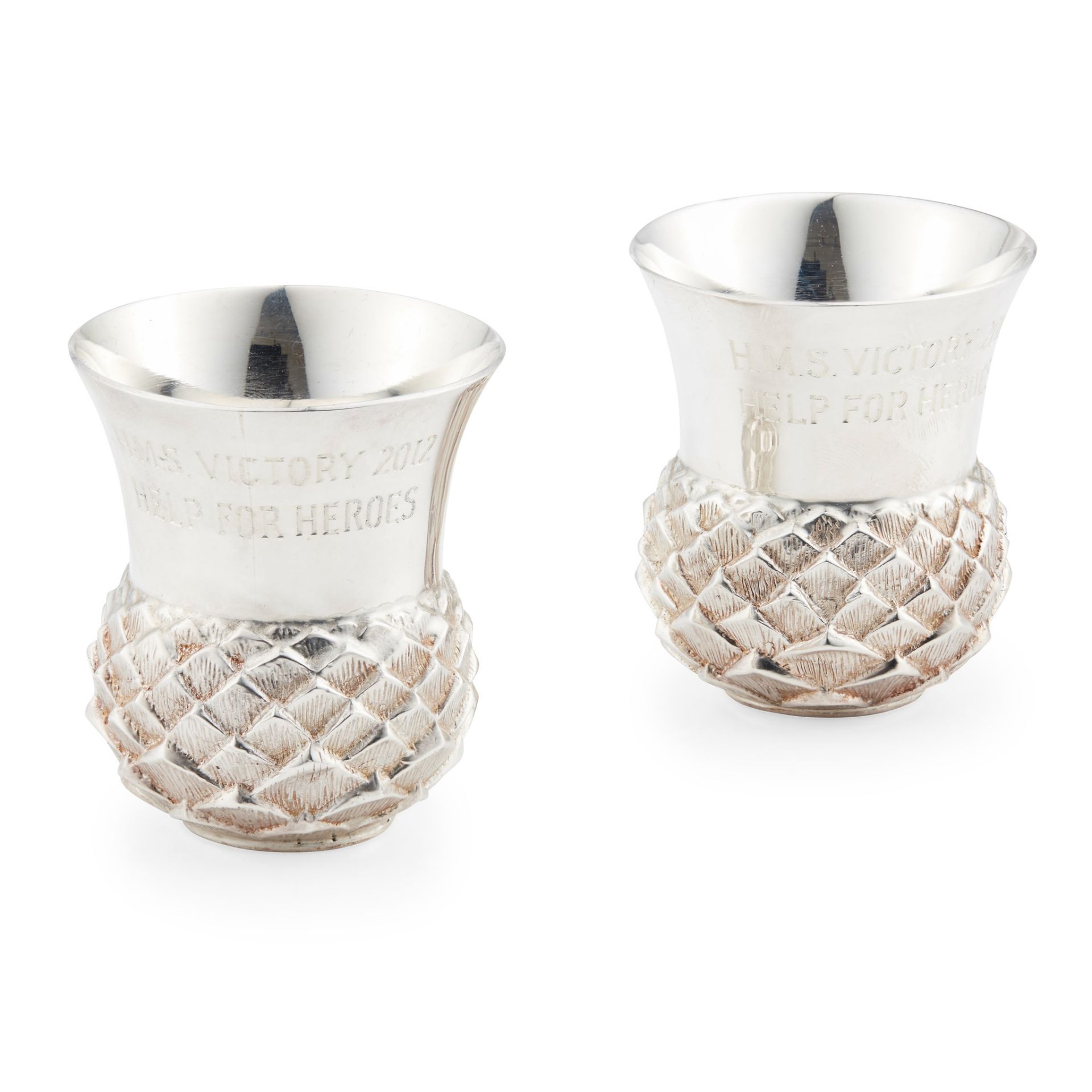 A pair of Britannia standard thistle tot cups