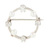 A diamond and pearl set brooch