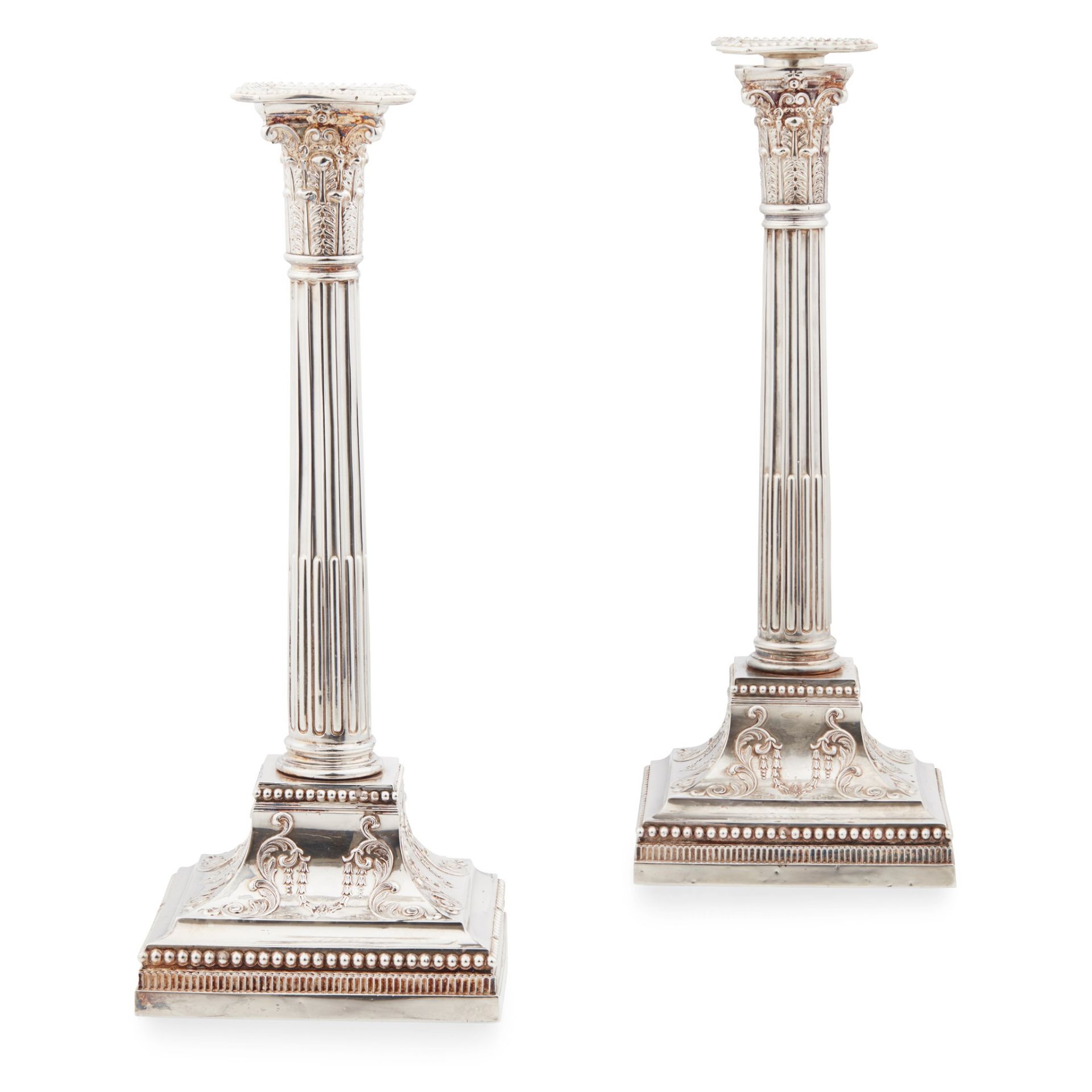 A pair of Edwardian 'Adam style' candlesticks