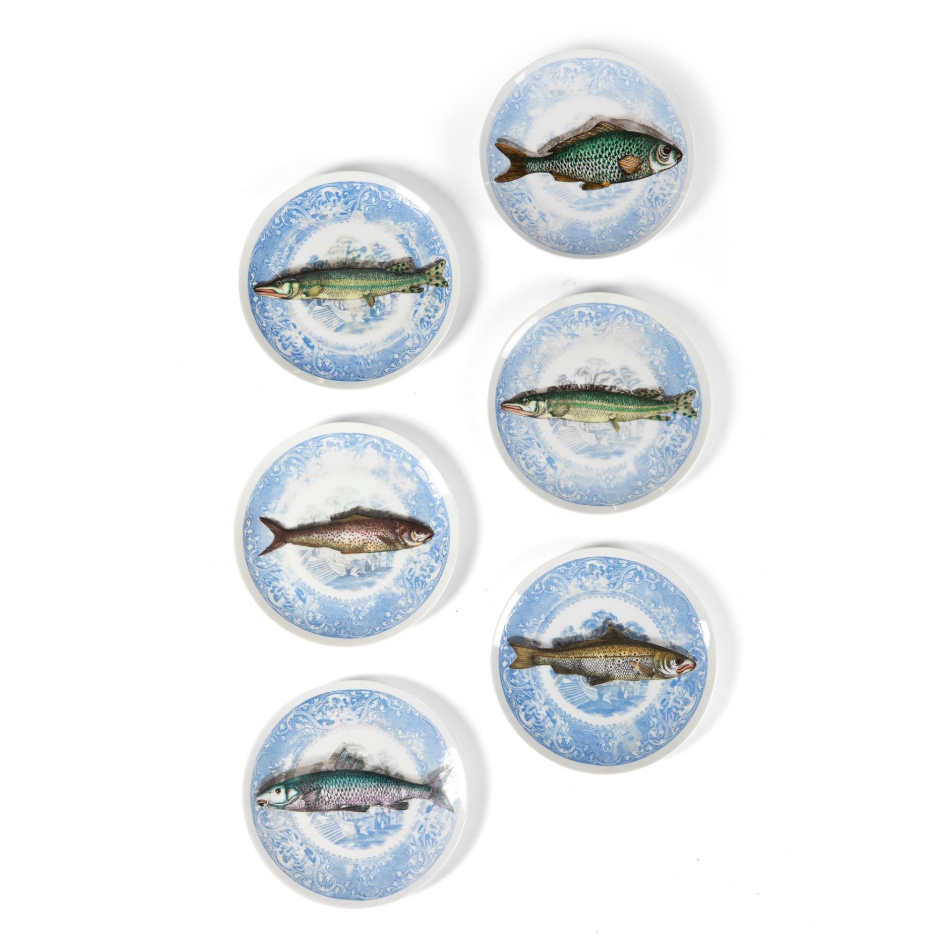 PIERO FORNASETTI (ITALIAN 1913-1988) SET OF SIX 'PISCIBUS' TROMPE L'OEIL PLATES