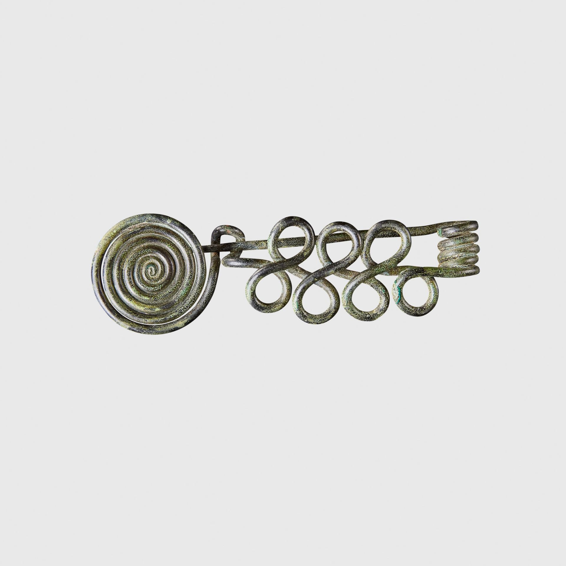 BRONZE AGE COILED BROOCH CENTRAL EUROPE, C. 11TH - 10TH CENTURY B.C.