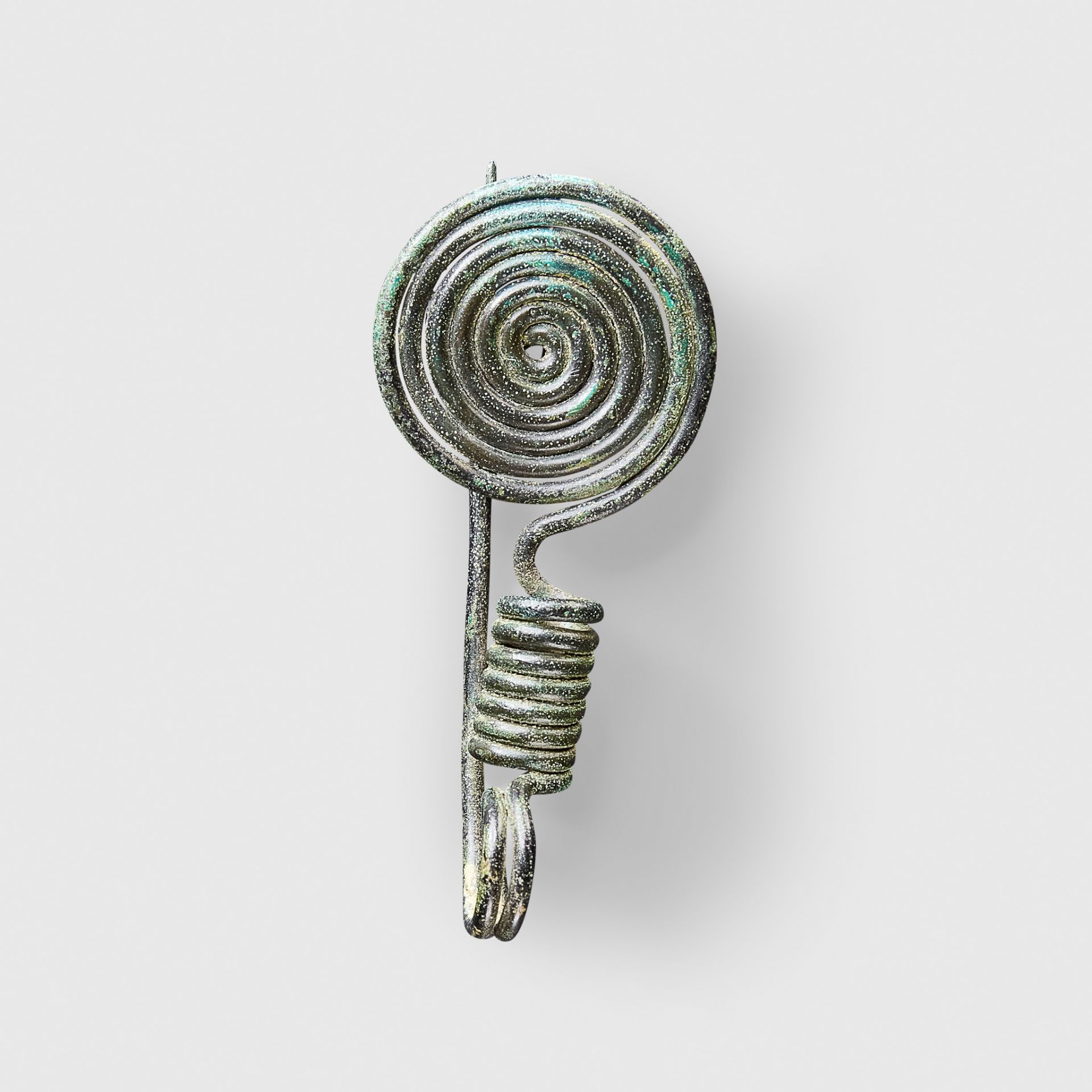 BRONZE AGE SPIRAL BROOCH CENTRAL EUROPE, C. 11TH - 10TH CENTURY B.C.