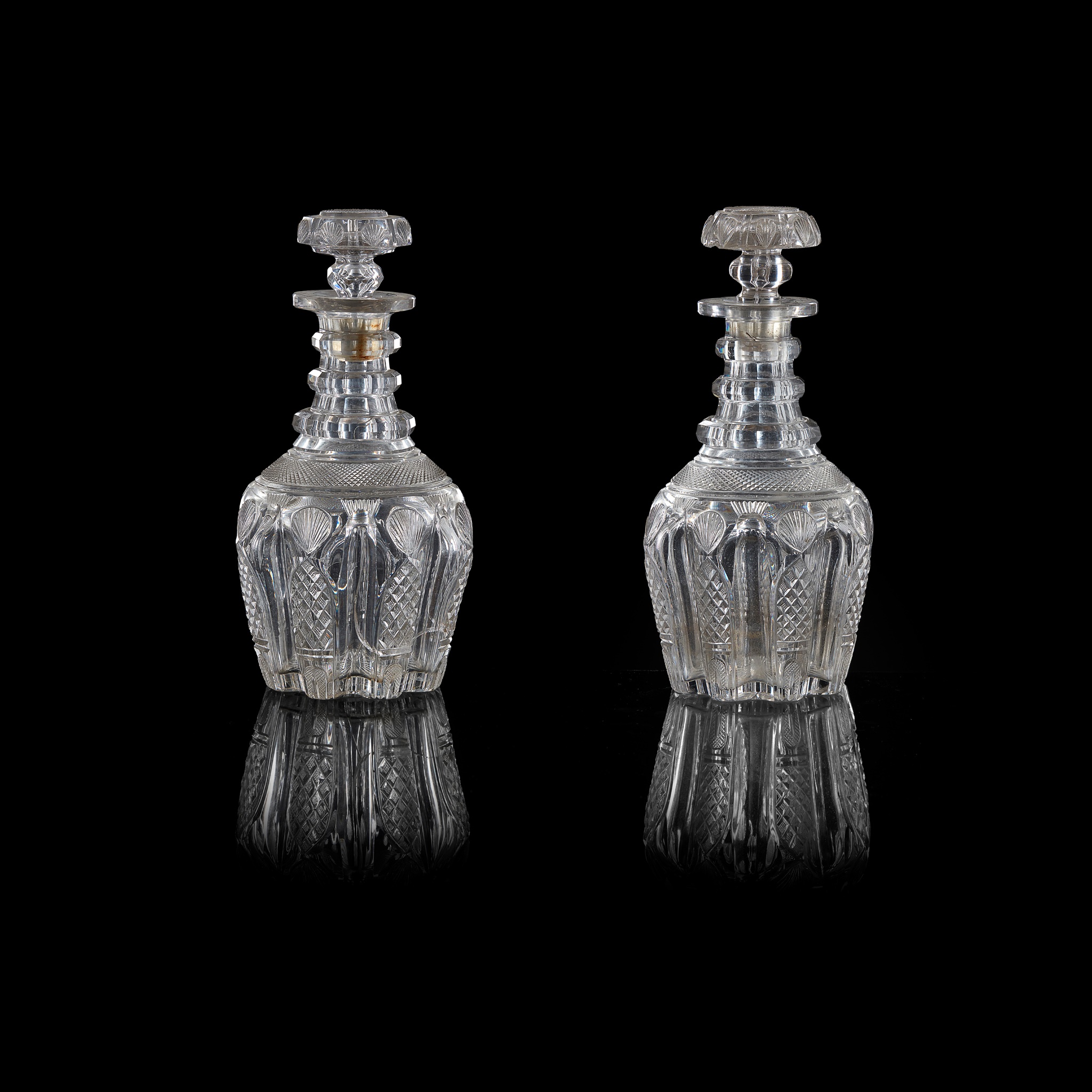 PAIR OF FULL BOTTLE TRIPLE NECK RING DECANTERS AND A MATCHING HALF BOTTLE DECANTER EARLY 19TH