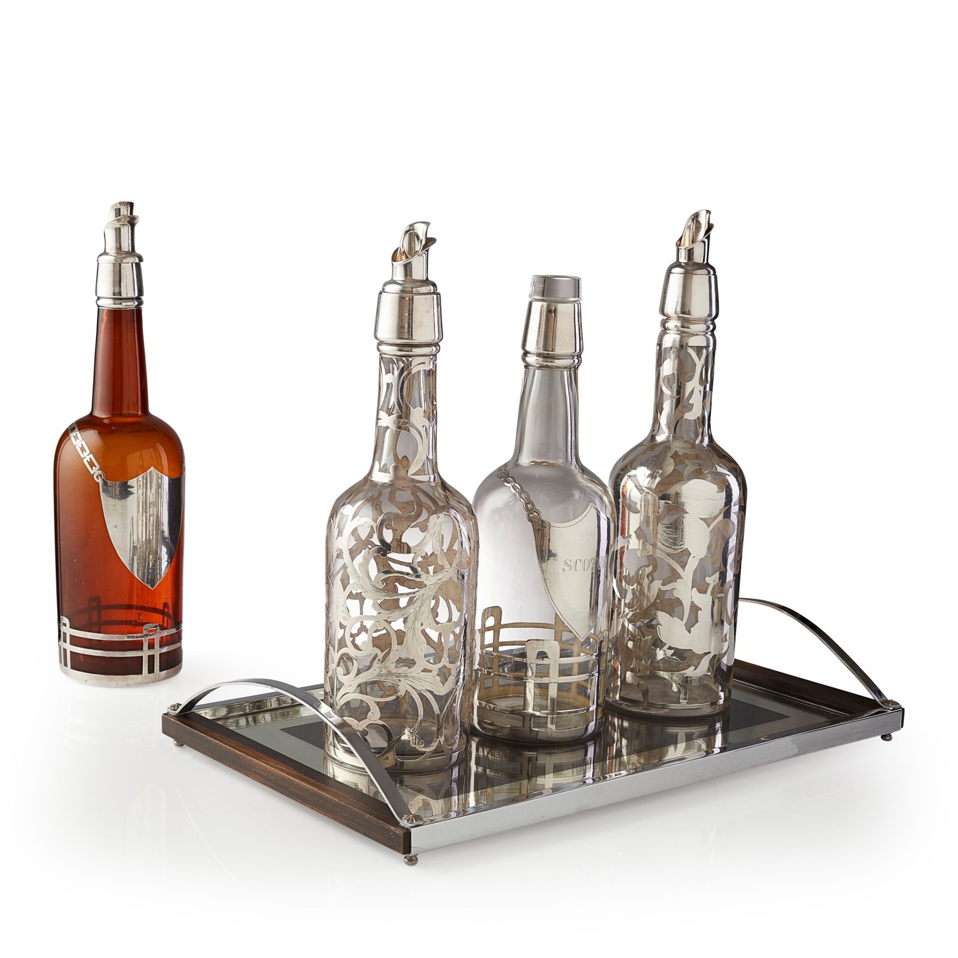 FOUR CONTINENTAL GLASS AND SILVER DECANTERS CIRCA 1930S