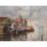 WILLIAM MARSHALL BROWN R.S.A., R.S.W (SCOTTISH 1863-1936) BARGES IN A RIVERSIDE TOWN