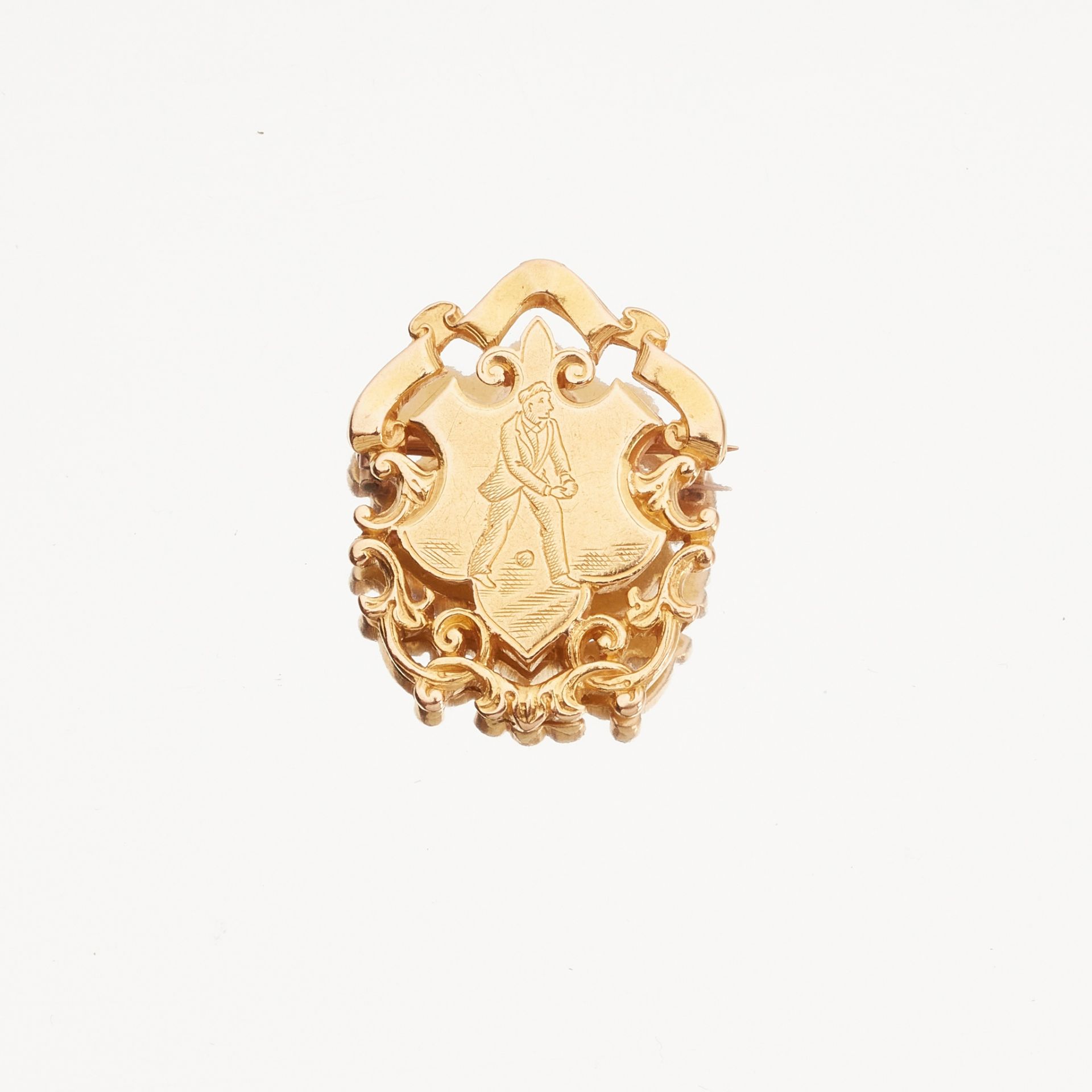 An 18ct gold Golfing badge