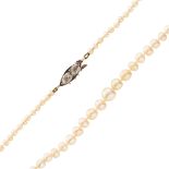 A natural pearl and diamond set necklace