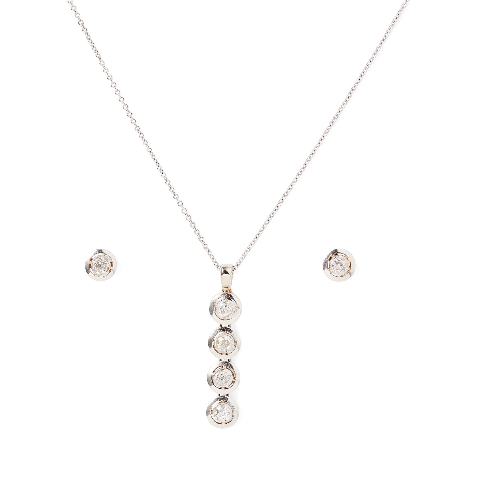 A diamond pendant and matching earrings