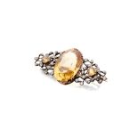 A citrine and diamond set brooch