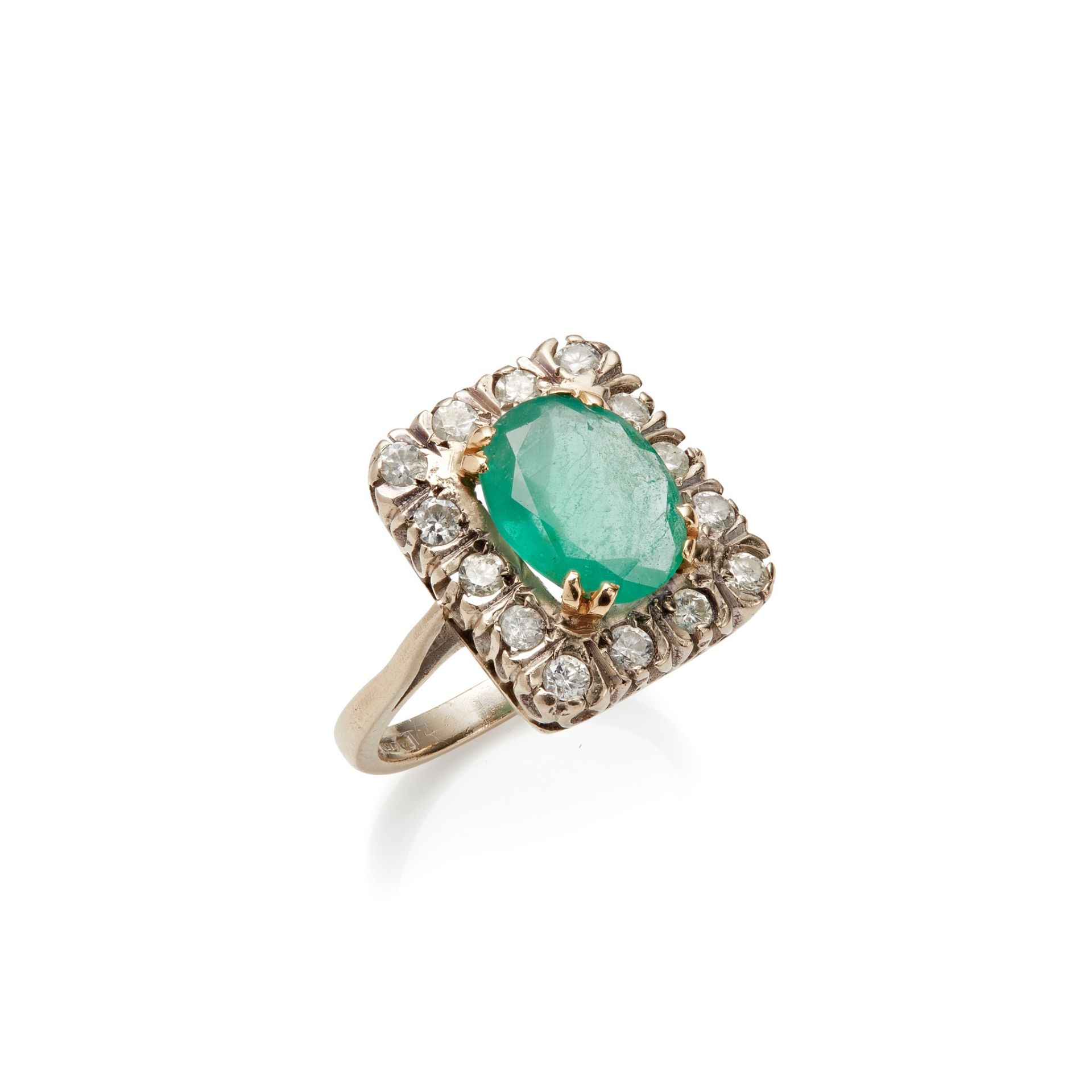 An emerald and diamond set ring