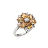 A citrine and diamond set cluster ring