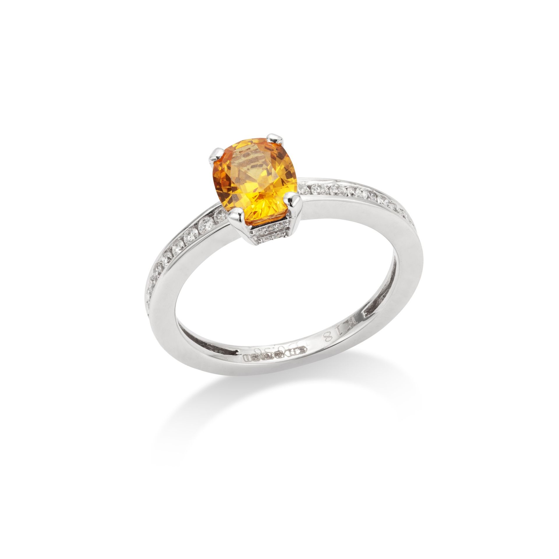 A yellow sapphire and diamond ring The oval-cut yellow sapphire, to brilliant-cut diamond-set