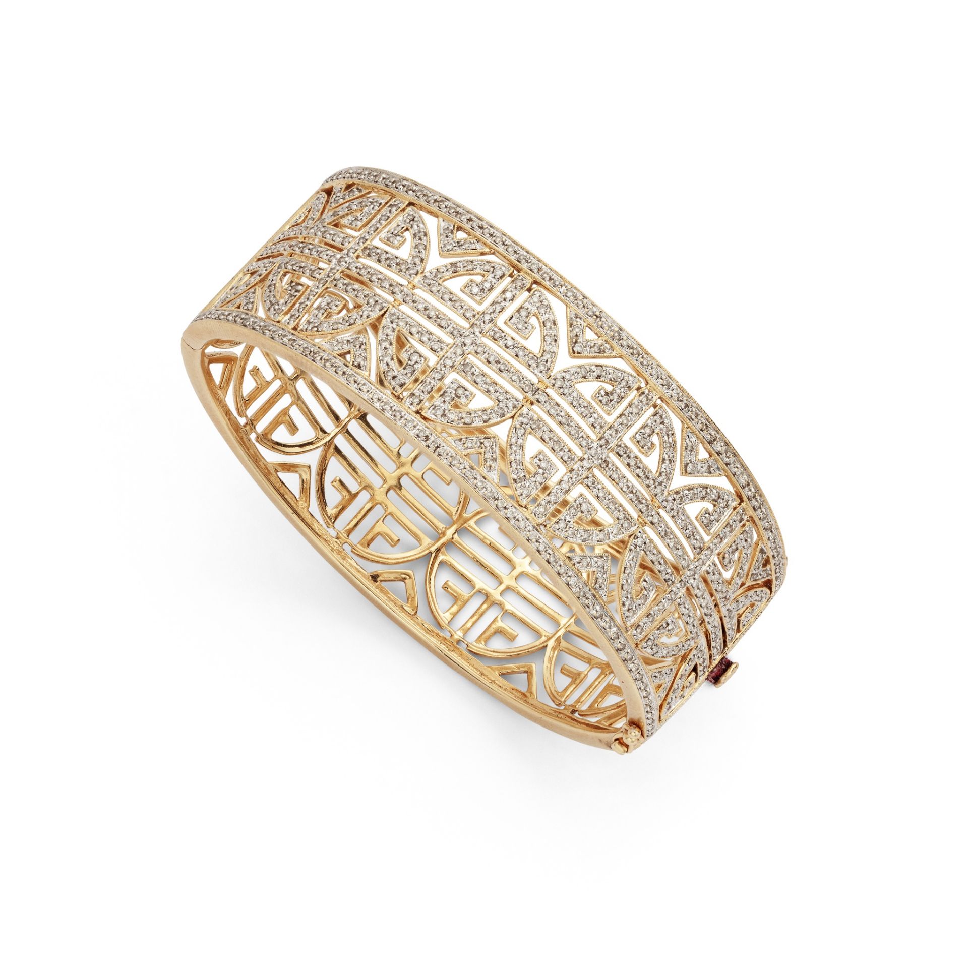 A diamond-set bangle The wide bangle of bi-coloured openwork geometric design, set to the front with