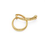 A letter brooch, by Elsa Peretti for Tiffany & Co. Designed as a cursive letter "O", signed