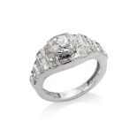 A diamond-set band ring Collet-set with an old brilliant-cut diamond on a tapered band set with