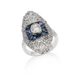 A sapphire and diamond dress ring The navette-shaped plaque centrally-set with an oval-cut