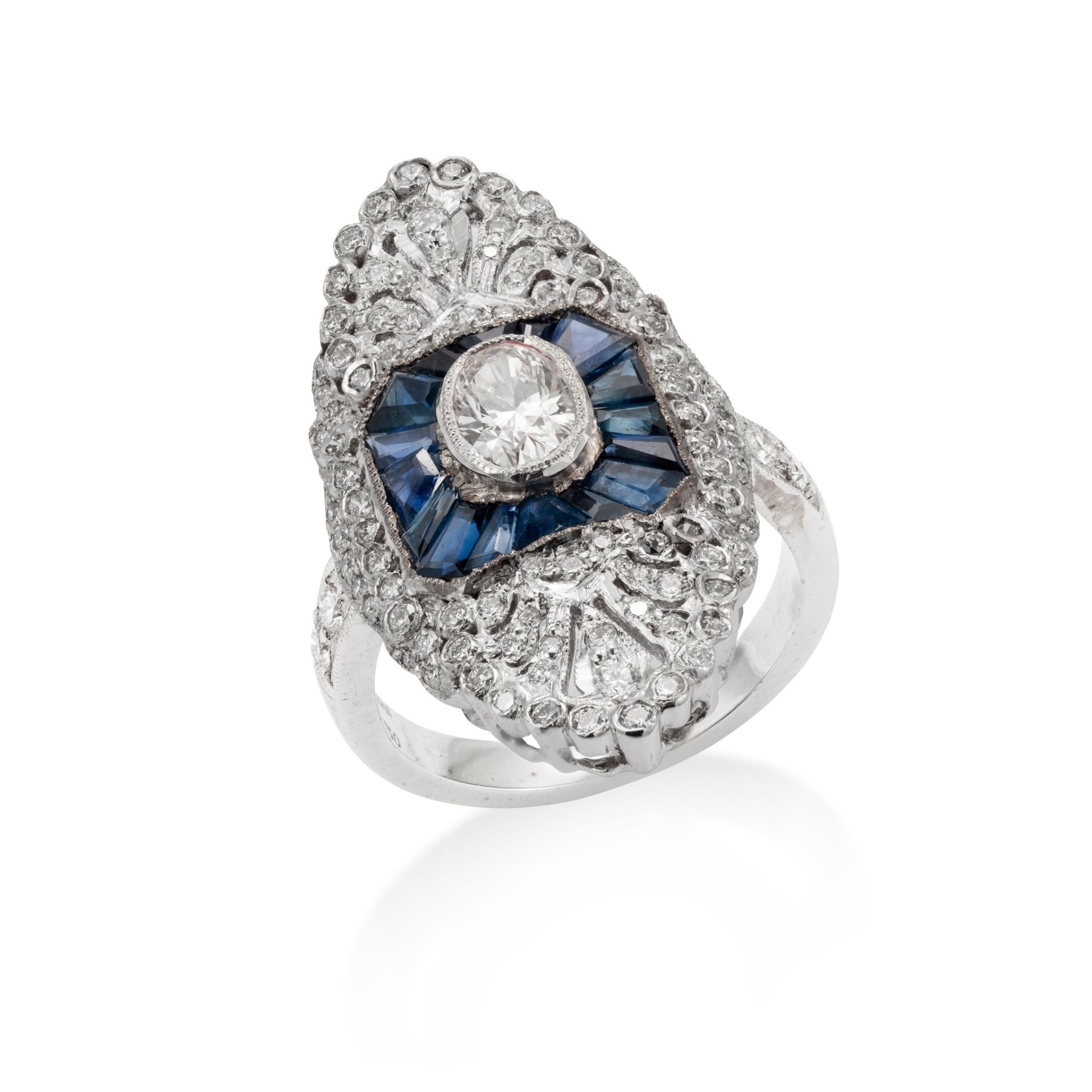 A sapphire and diamond dress ring The navette-shaped plaque centrally-set with an oval-cut