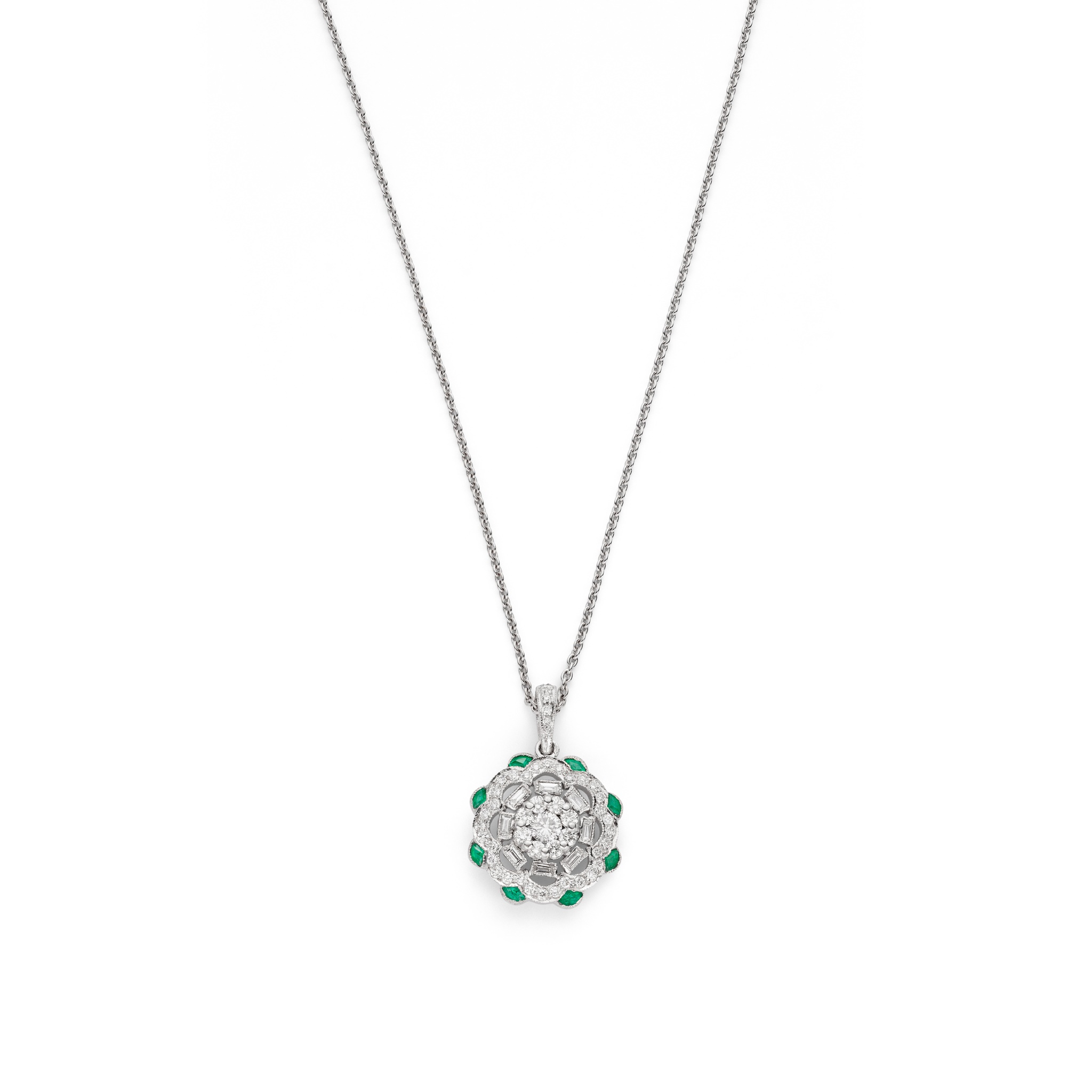 An emerald and diamond pendant Of pierced flowerhead design, set with a brilliant-cut diamond