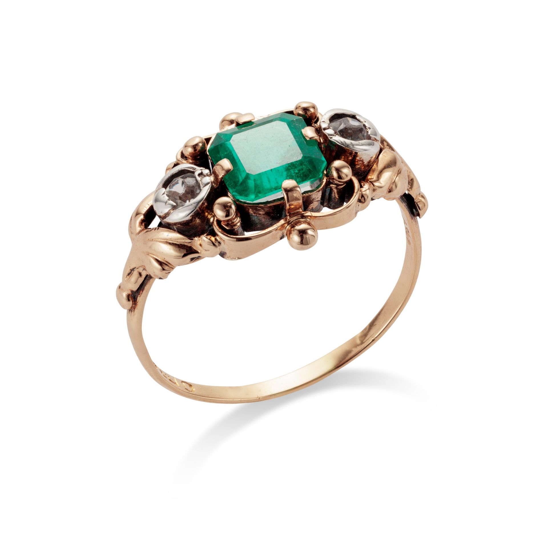 A mid 20th century emerald ring, circa 1945 The cut-cornered step-cut emerald, weighing 1.31 carats,