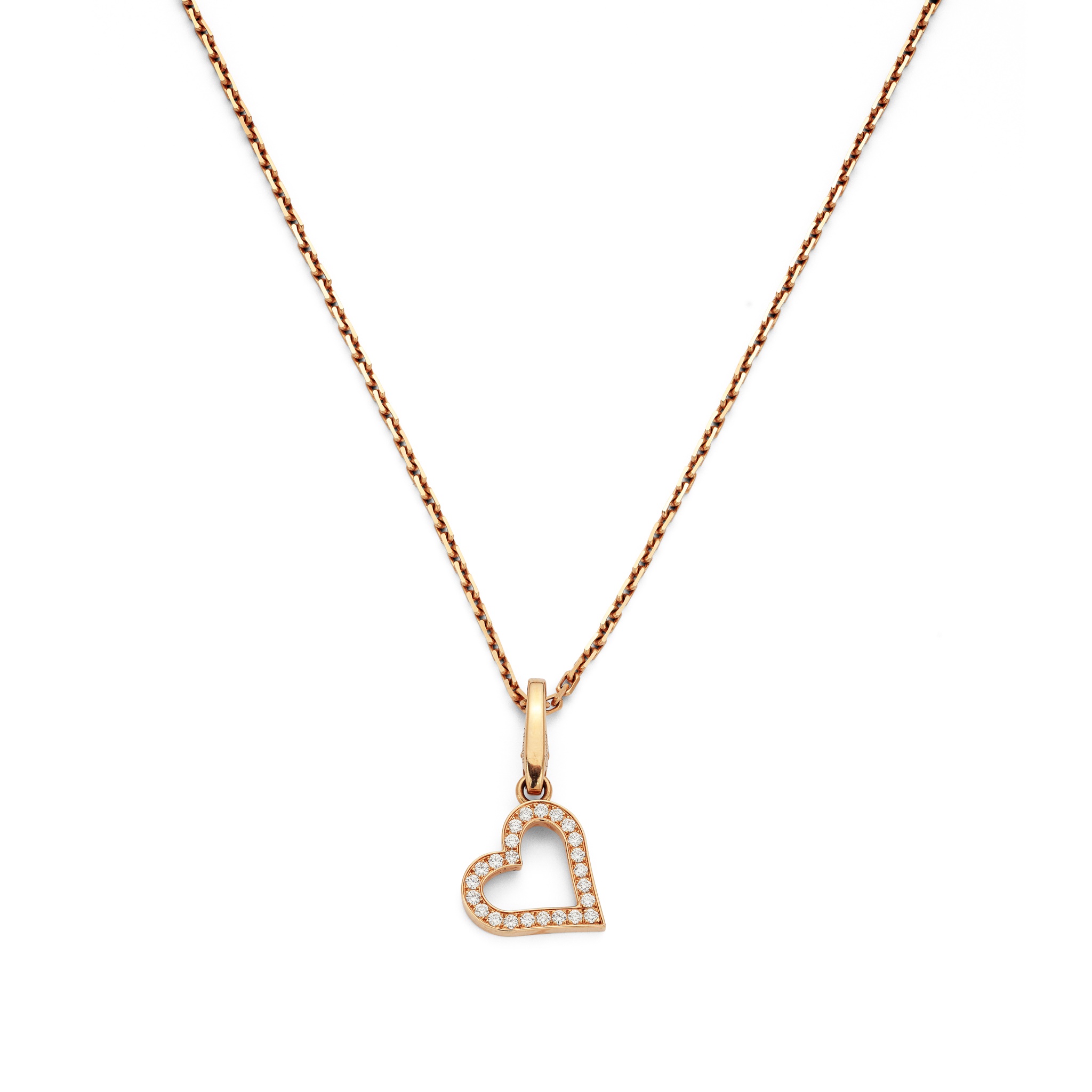 A diamond-set pendant necklace, by Cartier The openwork heart-shaped charm pendant, suspended from a